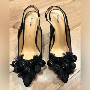 Black party shoes with beaded balls and tassels